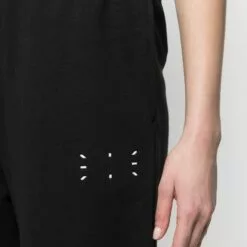 MCQ Graphic-print Cotton Track Trousers In 1000 BLACK - Track Pants -MCQ store online 16325386 31482183 600